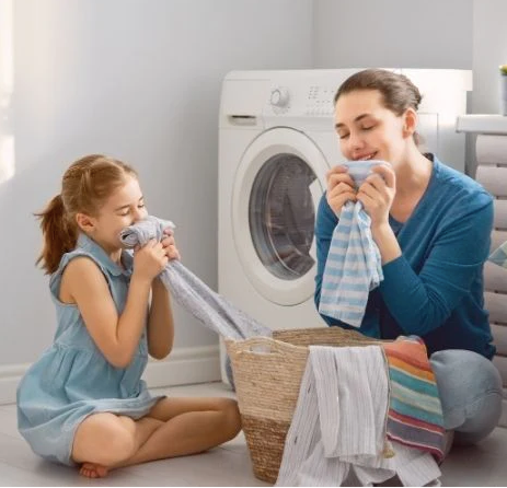 Mother and daughter smelling laundry, the truth about dryer sheets