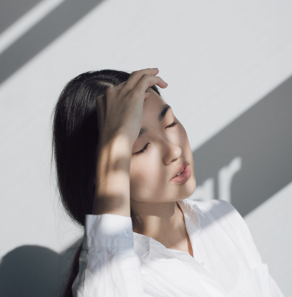 Woman with closed eyes, electromagnetic hypersensitivity syndrome